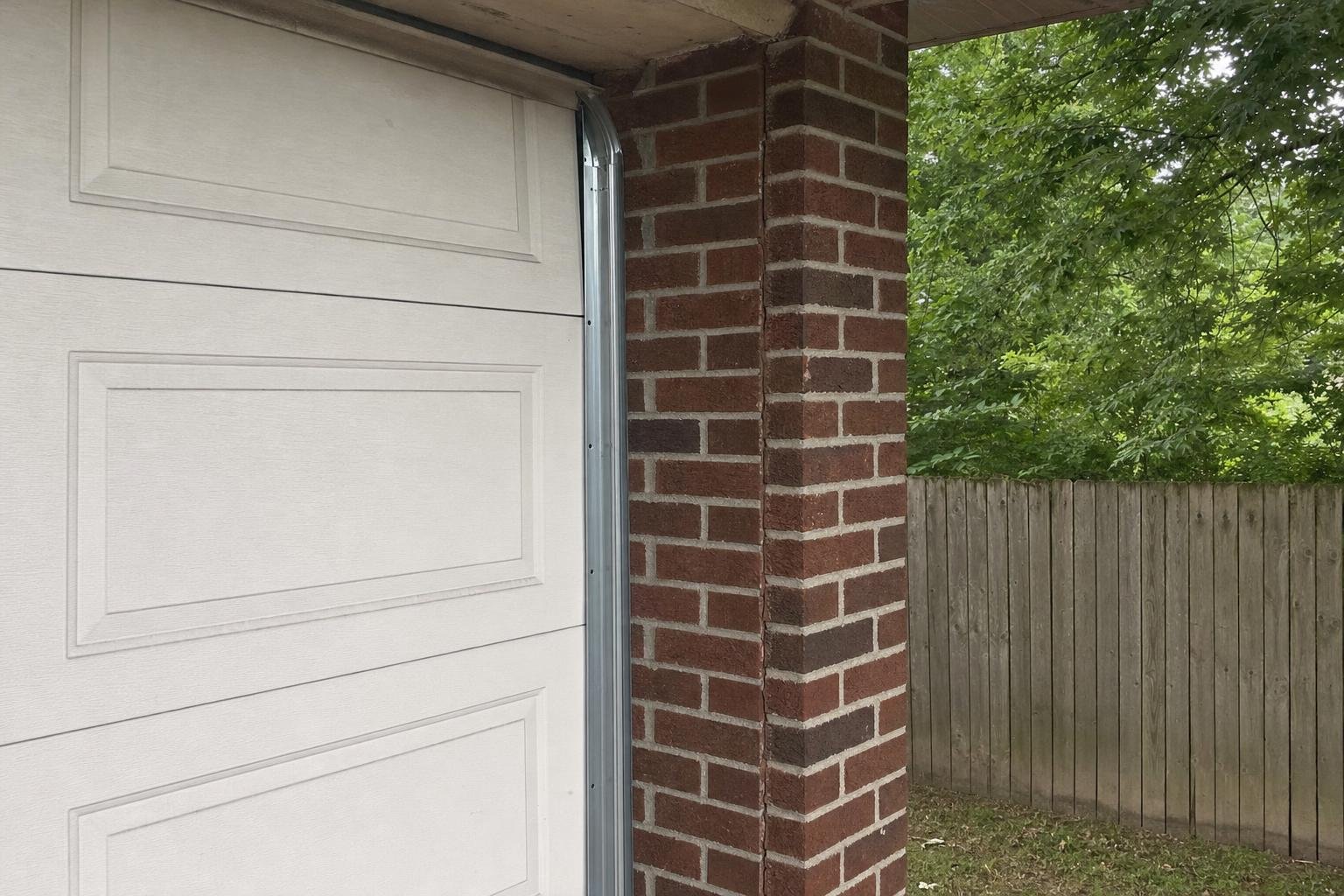 Illustrative image of garage door track realignment and repair work example